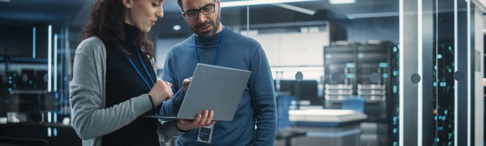 Woman and man on laptop